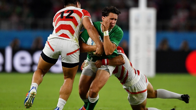 Joey Carbery is tackled by Ryoto Nakamura (l) and Shota Horie