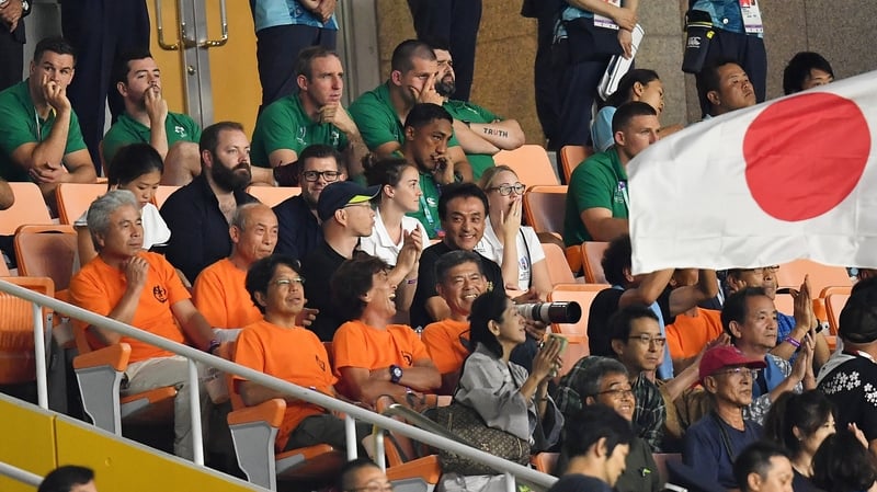 Members of the Ireland squad look on