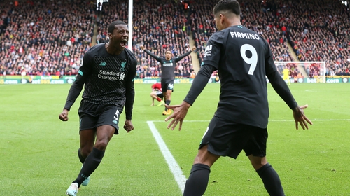 Liverpool's Georginio Wijnaldum celebrates scoring with team-mate Roberto Firmino