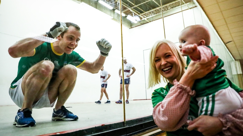 Brian Carroll celebrates as his wife Michelle and daughter Isobel look on