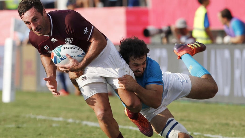 Rodrigo Silva (R) of Uruguay tackles Alexander Todua of Georgia