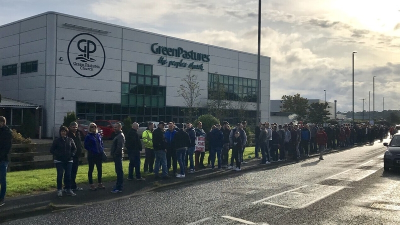 Protesters gathered outside the Green Pastures church in Ballymena, adjacent to one of the company's factories