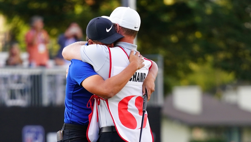 Cameron Champ embraces his caddie after to winning the Safeway Open