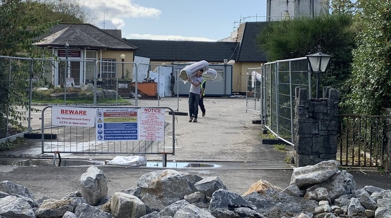 Construction workers remove materials from the former Connemara Gateway Hotel