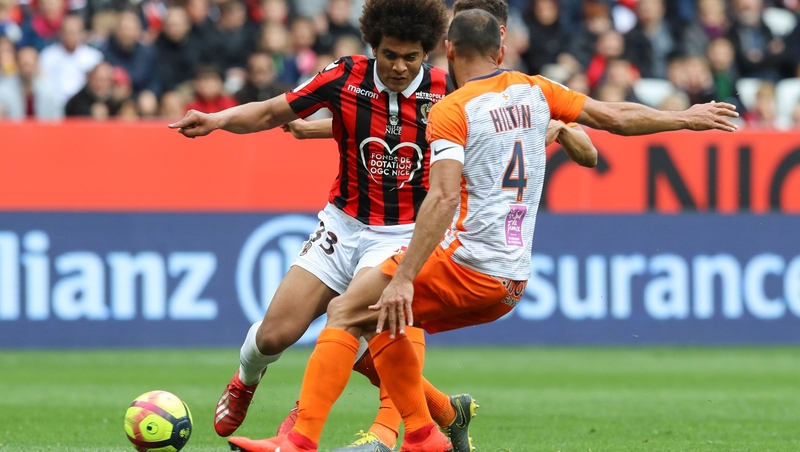 Lamine Diaby Fadiga (L, black and red shirt) in action for Nice