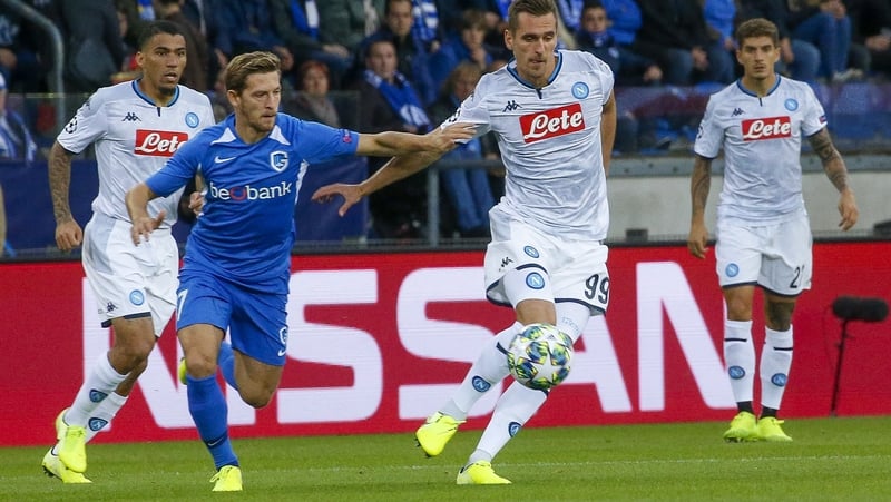 Theo Bongonda attempts to win possession off Napoli's Arkadiusz Milik at the Luminus Arena in Belgium