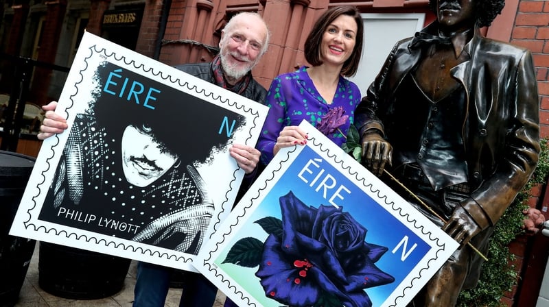 Jim Fitzpatrick and Aoife Beirne, An Post, Chief of Staff pictured at the Phil Lynott statue in Dublin