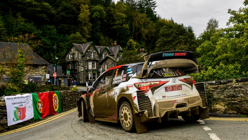 Kris Meeke guides his mud-splattered Yaris through pretty Llandudno