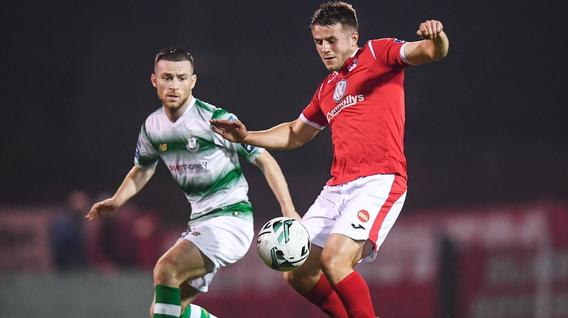 Regan Donelon of Sligo Rovers in action against Jack Byrne of Shamrock Rovers