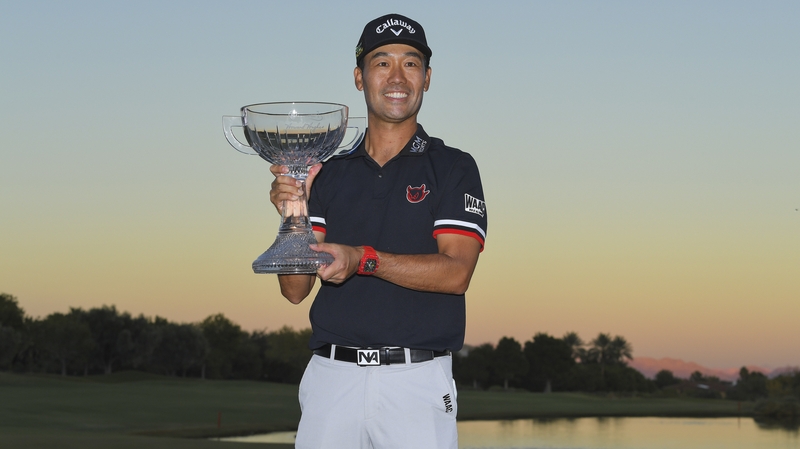 Kevin Na celebrates with the trophy