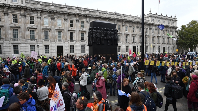 In London, demonstrators shut down roads around parliament and Whitehall, with vehicles and bikes, and banners reading 'tell the truth' and 'no coal mines, no fracking'