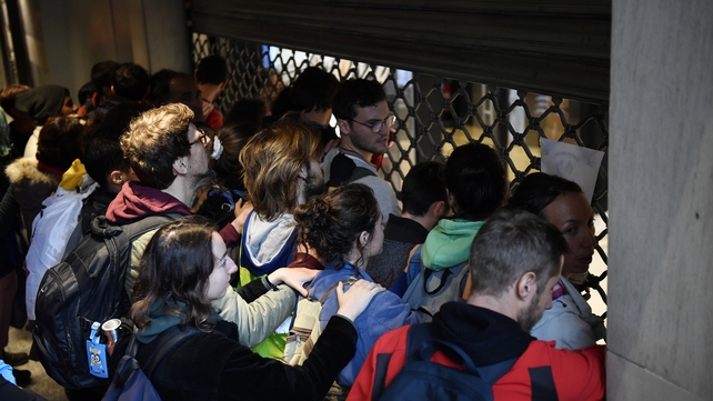 French environmental activists take part in a demonstration organised by Extinction Rebellion movement inside the shopping mall Italie 2 in Paris