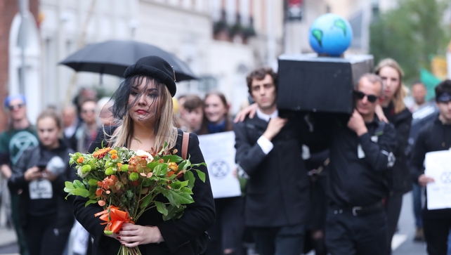 Protesters carry a coffin outside Leinster House during the Dublin demonstration