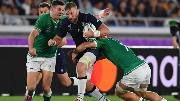 John Barclay is tackled by Ireland's Johnny Sexton and Josh van der Flier on the 22 September