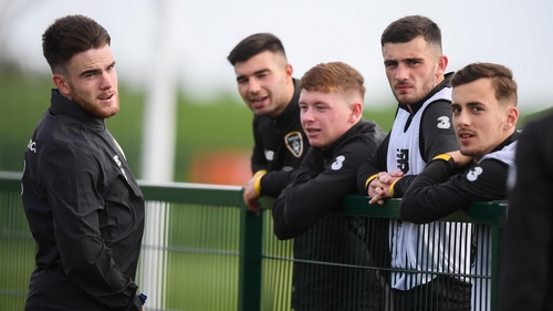 Aaron Connolly talking to his Republic of Ireland colleagues, now possibly former as he steps up to the senior squad
