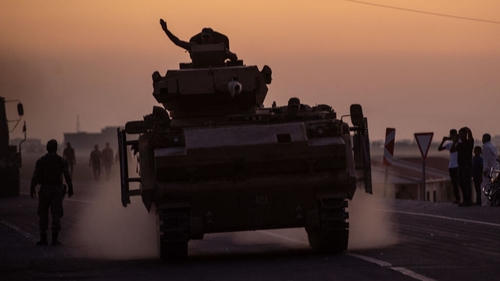 Turkish soldiers prepare to cross the border into Syria