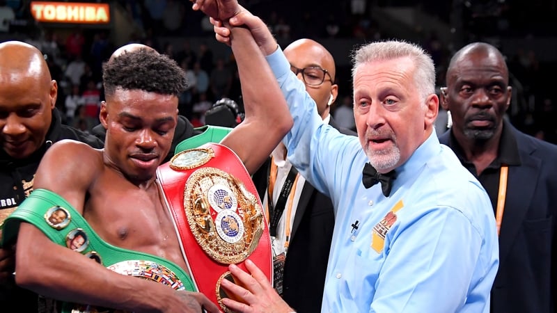 Erroll Spence Jr (L) has his arm raised after he defeated Shawn Porter