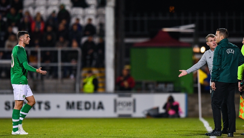 Troy Parrott (L) leaves the pitch after being sent off