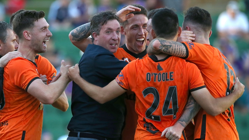 Robbie Fowler joins in the celebrations after Roy O'Donovan's late leveller
