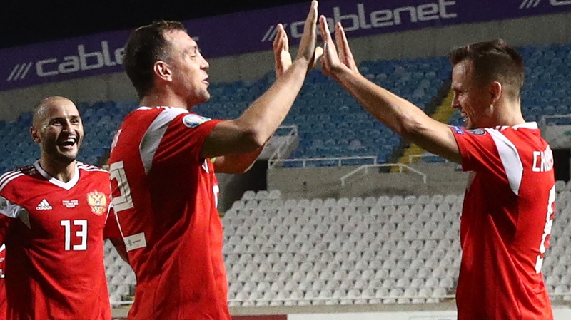 Russia's Fyodor Kudryashov, Artyom Dzyuba and Denis Cheryshev (L-R) celebrate in Cyprus
