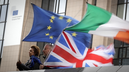 Anti-Brexit demonstrators wave a European, an Irish and a British flag in Brussels last week