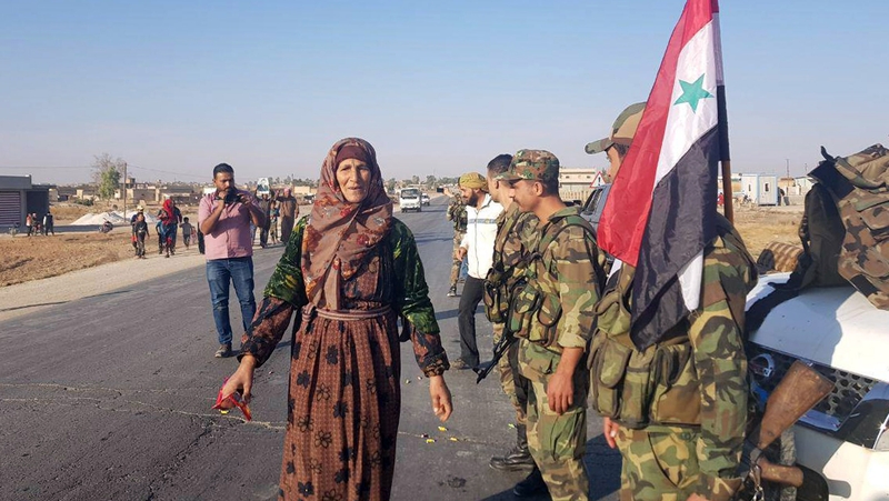 Images from the Syrian Arab News Agency shows civilians welcoming Syrian army soldiers in Tal Tamr