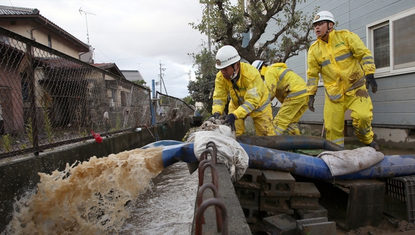 Pumping operations were being carried out where floodwaters submerged homes and vehicles after Typhoon Hagibis