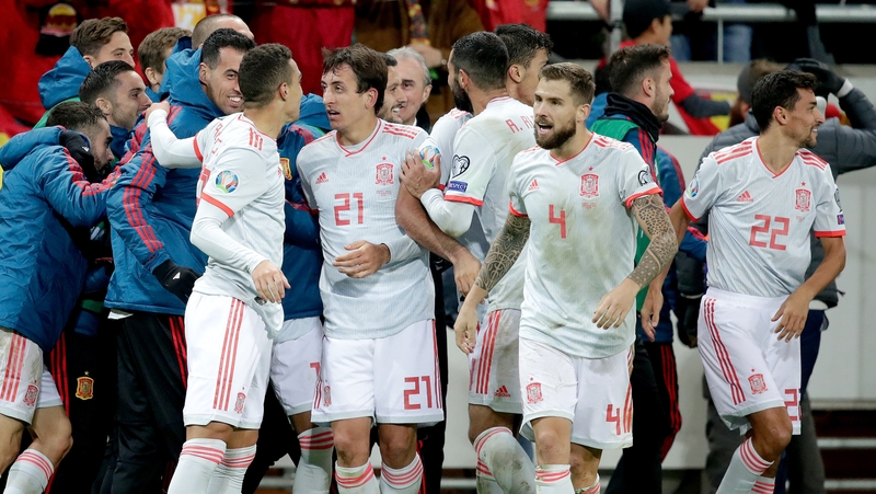 (L-R) Mikel Oyarzabal, Inigo Martinez and Jesus Navas mob Rodrigo