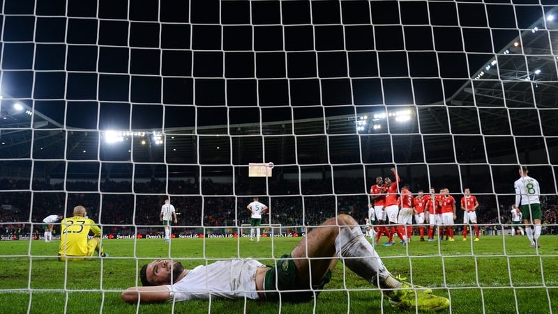 Shane Duffy and Darren Randolph - two of Ireland's better players in Geneva - cut dejected figures as the hosts make it 2-0 in the dying seconds