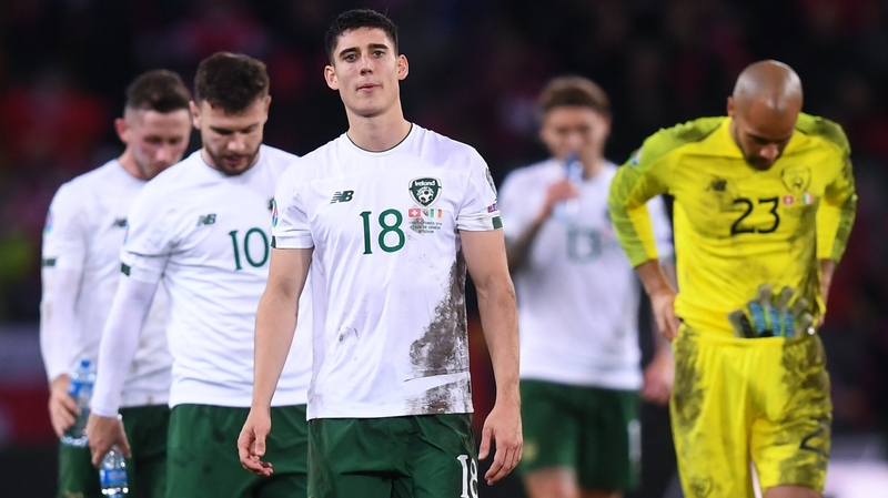 Dejected Ireland players leave the field after their defeat to Switzerland
