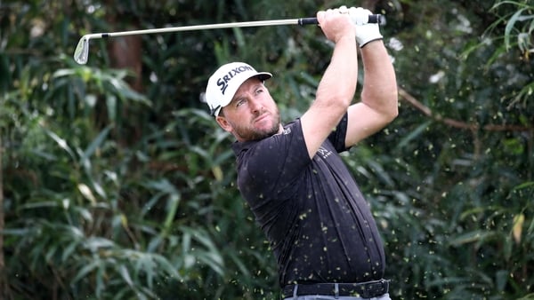 Graeme McDowell hits his tee shot on the 7th hole