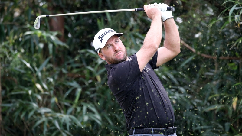 Graeme McDowell hits his tee shot on the 7th hole