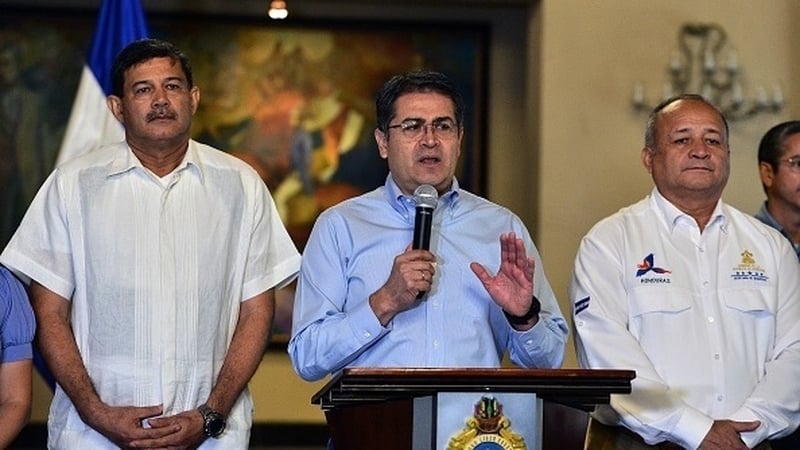 Juan Orlando Hernandez delivers a press conference following his brother's conviction