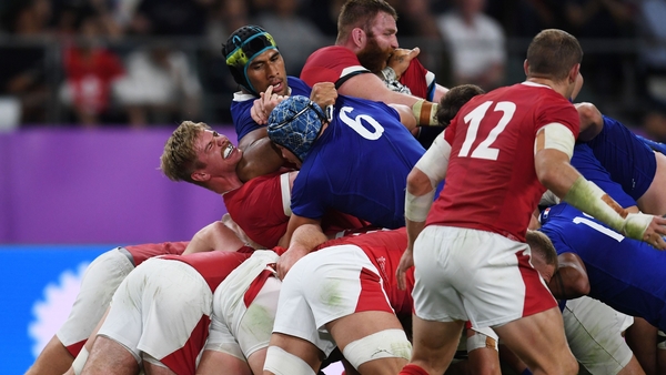 Sebastien Vahaamahina (black cap) elbowed Wales' Aaron Wainwright (L)