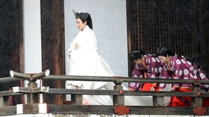 The empress wore a multi-layered kimono, trailed by attendants to help her move in the weighty outfit