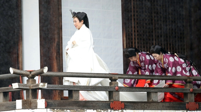 The empress wore a multi-layered kimono, trailed by attendants to help her move in the weighty outfit