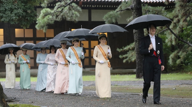 The royal family filed into the palace's Pine Room dressed in heavy robes