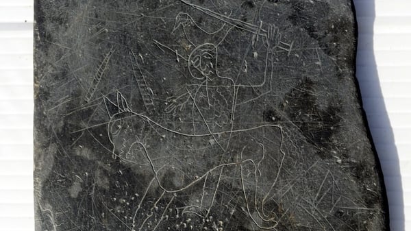 The slate was carved with graffitti dating back to the 12th Century