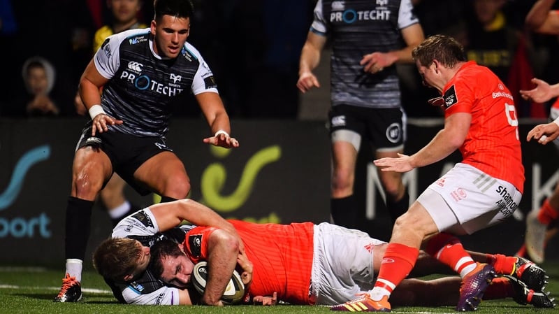 James Cronin scores Munster's first try despite the best efforts of Olly Cracknell