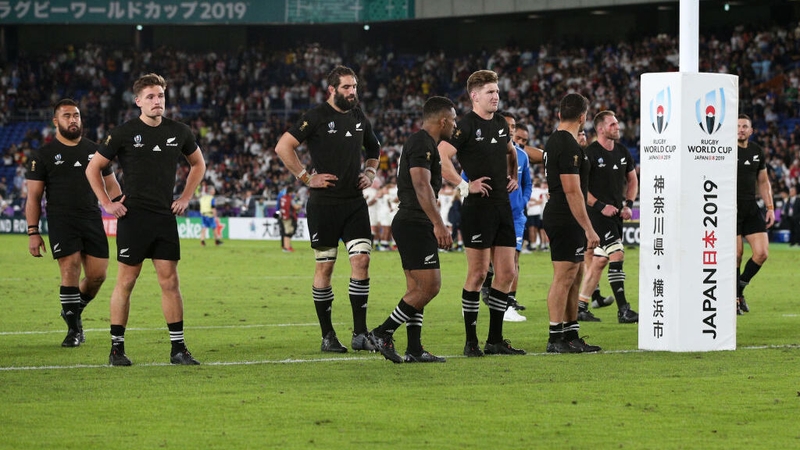 New Zealand players look dejected in defeat