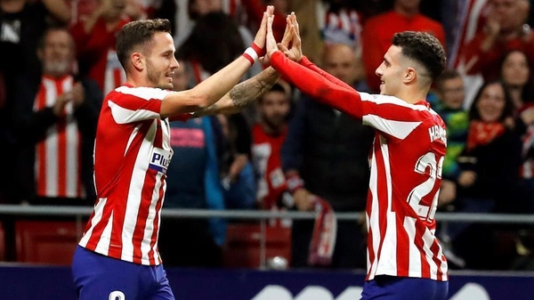 Saul Niguez (L) celebrates with team-mate Mario Hermoso after Atletico's first