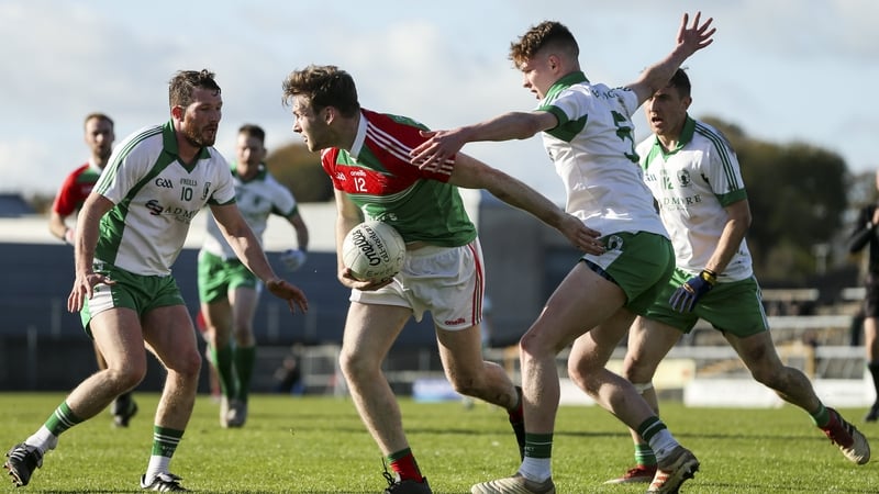 Michael Monaghan of Garrycastle in action against Denis McGoldrick and Niall Farrelly of Killoe Emmet Og