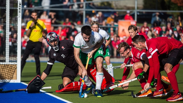 John McKee attempts to evade a whole host of Canada players