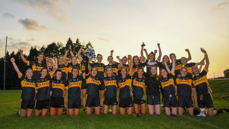 Mourneabbey players celebrate with the trophy