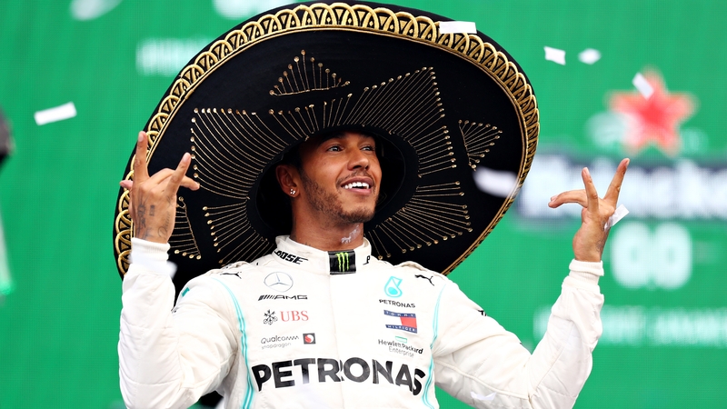 Lewis Hamilton celebrates on the podium