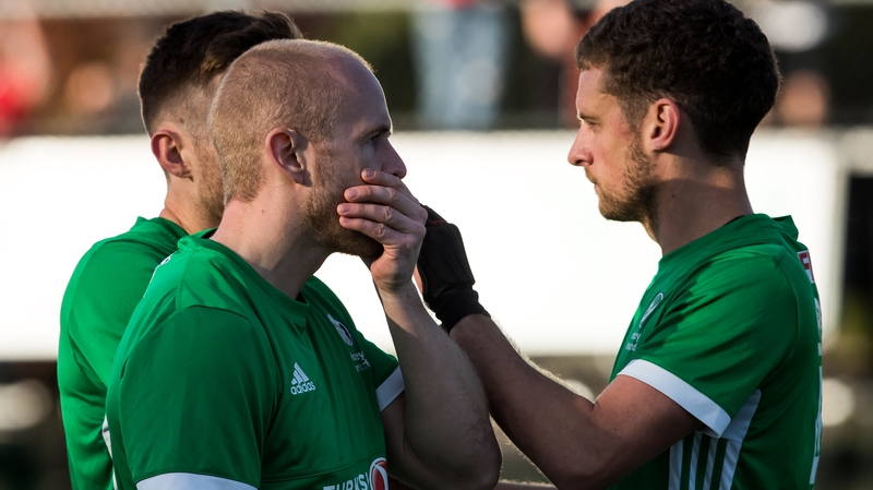 Eugene Magee (L) and Jonathan Bell react after losing to Canada