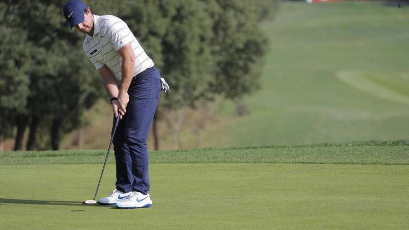 Rory McIlroy lines up a putt