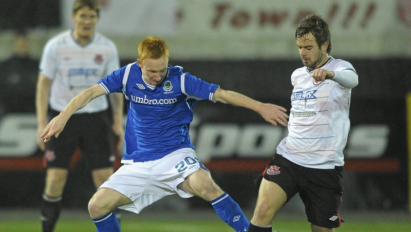 Dundalk's Greg Bolger battles for possession against Linfield's Robert Garrett during a 2011 Setanta Cup clash