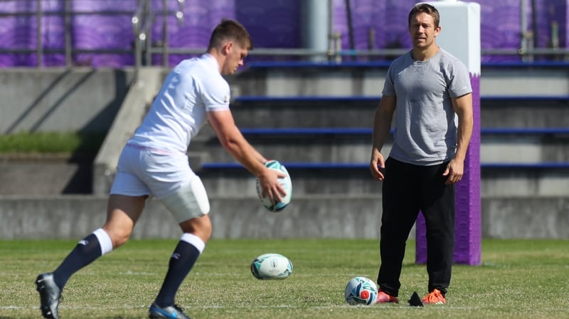 England captain Owen Farrell practises his drop-kicks as Jonny Wilkinson looks on