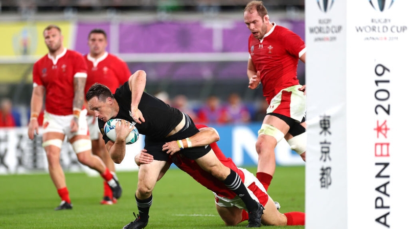 Ben Smith crosses for New Zealand in the first half against Wales in Yokohama